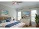 Charming bedroom with a comfortable bed, coastal-inspired decor, and bright windows for a relaxing retreat at 368 Ginger Cake Rd, Fayetteville, GA 30214