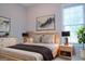 Serene bedroom showcasing a wooden bed frame, natural light, and stylish decor elements at 368 Ginger Cake Rd, Fayetteville, GA 30214