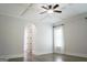 Bedroom showcasing a tray ceiling, a window and an archway into the ensuite bathroom at 368 Ginger Cake Rd, Fayetteville, GA 30214