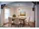 A charming dining room with an artistic light fixture and natural light at 368 Ginger Cake Rd, Fayetteville, GA 30214