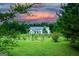 Charming home featuring a landscaped yard and a backdrop of trees, offering both curb appeal and a serene setting at 368 Ginger Cake Rd, Fayetteville, GA 30214
