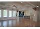 Open-concept living space with hardwood floors, lots of natural light and adjacent kitchen at 368 Ginger Cake Rd, Fayetteville, GA 30214