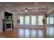 An expansive living area with a cozy fireplace, and large windows at 368 Ginger Cake Rd, Fayetteville, GA 30214