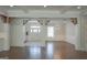 Spacious living area with beautiful flooring, exposed beams, and an inviting atmosphere at 368 Ginger Cake Rd, Fayetteville, GA 30214