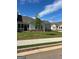 Backyard featuring a screened-in porch, green lawn, and manicured landscaping at 3706 Cheswoilde Ave # 96, Powder Springs, GA 30127