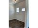 Bright entryway with a dark wood floor, white trim, and a door with glass window panes at 3706 Cheswoilde Ave # 96, Powder Springs, GA 30127