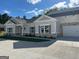 Charming single-story home featuring a brick facade, neutral siding, and an attached two-car garage at 3706 Cheswoilde Ave # 96, Powder Springs, GA 30127