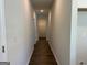 Hallway features wood-look flooring and neutral paint at 3706 Cheswoilde Ave # 96, Powder Springs, GA 30127