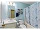 Well-lit bathroom with a single sink vanity, toilet, and shower-tub combination at 105 Meadow Spring'S Ct, Locust Grove, GA 30248