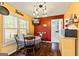 Cozy dining area with a round table, chairs, and natural light from the window at 105 Meadow Spring'S Ct, Locust Grove, GA 30248