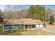 Charming single-story home with a well-maintained yard and an attached two-car garage at 105 Meadow Spring'S Ct, Locust Grove, GA 30248