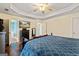 Large bedroom with hardwood floors, decorative ceilings, and access to the bathroom at 105 Meadow Spring'S Ct, Locust Grove, GA 30248