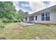 Expansive backyard with a small patio perfect for outdoor relaxation at 702 Brambling Way, Stockbridge, GA 30281