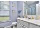 Bathroom with vanity and a large window at 702 Brambling Way, Stockbridge, GA 30281