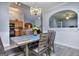 View from the dining room, showing the passthrough to kitchen and adjacent living space at 702 Brambling Way, Stockbridge, GA 30281