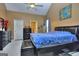 This main bedroom features a ceiling fan, a walk-in closet, and an attached bathroom with a standing shower at 702 Brambling Way, Stockbridge, GA 30281