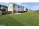 Large, open backyard featuring a concrete patio and wood fence, perfect for outdoor activities at 376 Layfield Dr, Jonesboro, GA 30238