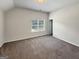 Bedroom featuring plush carpeting and a window that provides ample natural light at 376 Layfield Dr, Jonesboro, GA 30238