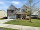 Charming two-story home with well-manicured lawn, brick accents, and attached two-car garage at 376 Layfield Dr, Jonesboro, GA 30238