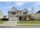 Charming two-story brick home featuring a well-maintained lawn and inviting entrance at 376 Layfield Dr, Jonesboro, GA 30238