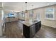 Island kitchen with stainless steel dishwasher and sink; open to living room at 376 Layfield Dr, Jonesboro, GA 30238