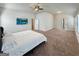 Spacious main bedroom featuring plush carpeting, ample natural light, and ensuite bathroom access at 376 Layfield Dr, Jonesboro, GA 30238