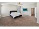 Large main bedroom with a king bed, ceiling fan, and an abundance of natural light at 376 Layfield Dr, Jonesboro, GA 30238