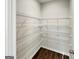Walk-in pantry with wood floors and ample wire shelving for efficient storage at 376 Layfield Dr, Jonesboro, GA 30238
