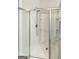 Close-up of shower with glass door and tiled walls at 376 Layfield Dr, Jonesboro, GA 30238