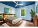 Relaxing bedroom featuring a king bed, wooden furnishings and natural lighting at 1213 Laurel Cliff Se Dr, Smyrna, GA 30082