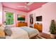 Bright bedroom with a cozy bed, sleek dresser, and pink ceiling at 1213 Laurel Cliff Se Dr, Smyrna, GA 30082