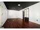 Expansive bonus room with dark ceilings, hardwood floors, and abundant natural light through sliding barn doors at 1213 Laurel Cliff Se Dr, Smyrna, GA 30082