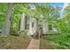 Stunning contemporary home featuring unique architectural details and mature landscaping at 1213 Laurel Cliff Se Dr, Smyrna, GA 30082