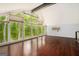 Bright living space with large windows showcasing beautiful green foliage, hardwood flooring and modern fixtures at 1213 Laurel Cliff Se Dr, Smyrna, GA 30082