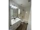 Modern bathroom with updated vanity, shower-tub combo, and stylish fixtures at 140 Clover Valley Dr, Covington, GA 30016