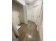 Practical laundry area with closet, shelving, and hardwood flooring at 140 Clover Valley Dr, Covington, GA 30016
