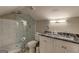 Bathroom with a modern glass shower and granite-topped vanity at 3464 Wren Rd, Decatur, GA 30032