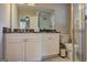 Bathroom featuring a vanity with granite countertop and shower with glass door at 3464 Wren Rd, Decatur, GA 30032