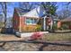 Charming brick home shows off its mature landscaping and inviting exterior at 3464 Wren Rd, Decatur, GA 30032