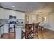 Bright kitchen featuring stainless steel appliances, granite countertops, and counter seating at 3464 Wren Rd, Decatur, GA 30032