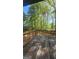 View of wooden deck with trees visible in the background at 402 Emmett St, Riverdale, GA 30274