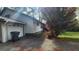 View of the attached garage and driveway showcasing the home's convenient parking at 402 Emmett St, Riverdale, GA 30274