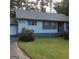 Charming single-story home with well-maintained lawn and classic architectural details at 402 Emmett St, Riverdale, GA 30274