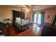 Bedroom with French doors leading to balcony at 402 Emmett St, Riverdale, GA 30274