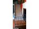 A carpeted staircase with a black metal railing, connecting two levels of the house at 402 Emmett St, Riverdale, GA 30274