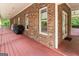 Spacious outdoor porch features brick exterior and patio access at 31 Butler Bridge Dr, Mcdonough, GA 30252