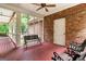 Covered porch with seating offers relaxing outdoor living space at 31 Butler Bridge Dr, Mcdonough, GA 30252