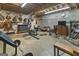Spacious basement area that includes gym equipment, decorations, and a TV at 31 Butler Bridge Dr, Mcdonough, GA 30252