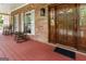 Inviting front porch with rocking chairs, a welcome mat, and brick facade at 31 Butler Bridge Dr, Mcdonough, GA 30252