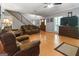 Spacious living room with hardwood floors, a ceiling fan, and abundant natural light at 31 Butler Bridge Dr, Mcdonough, GA 30252